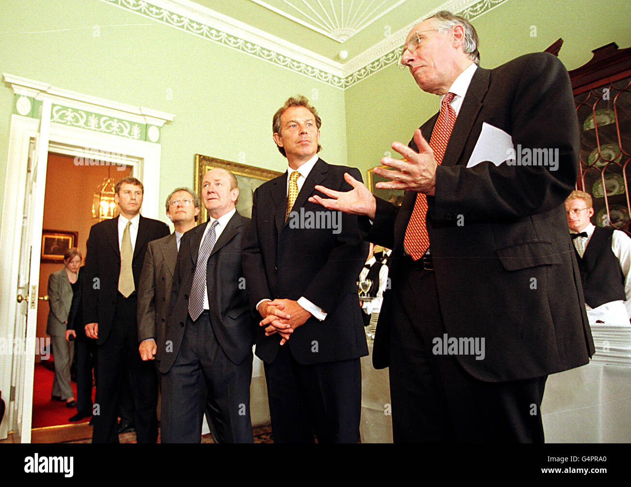 Prime Minister Tony Blair is met by Scotland`s First Minister Donald Dewar at Bute House in Edinburgh at a reception for businessmen and women. Also present from right to left are Secretary of State for Scotland John Reid, enterprise minister Henry Mcleish and his deputy Nicol Stephen. Stock Photo